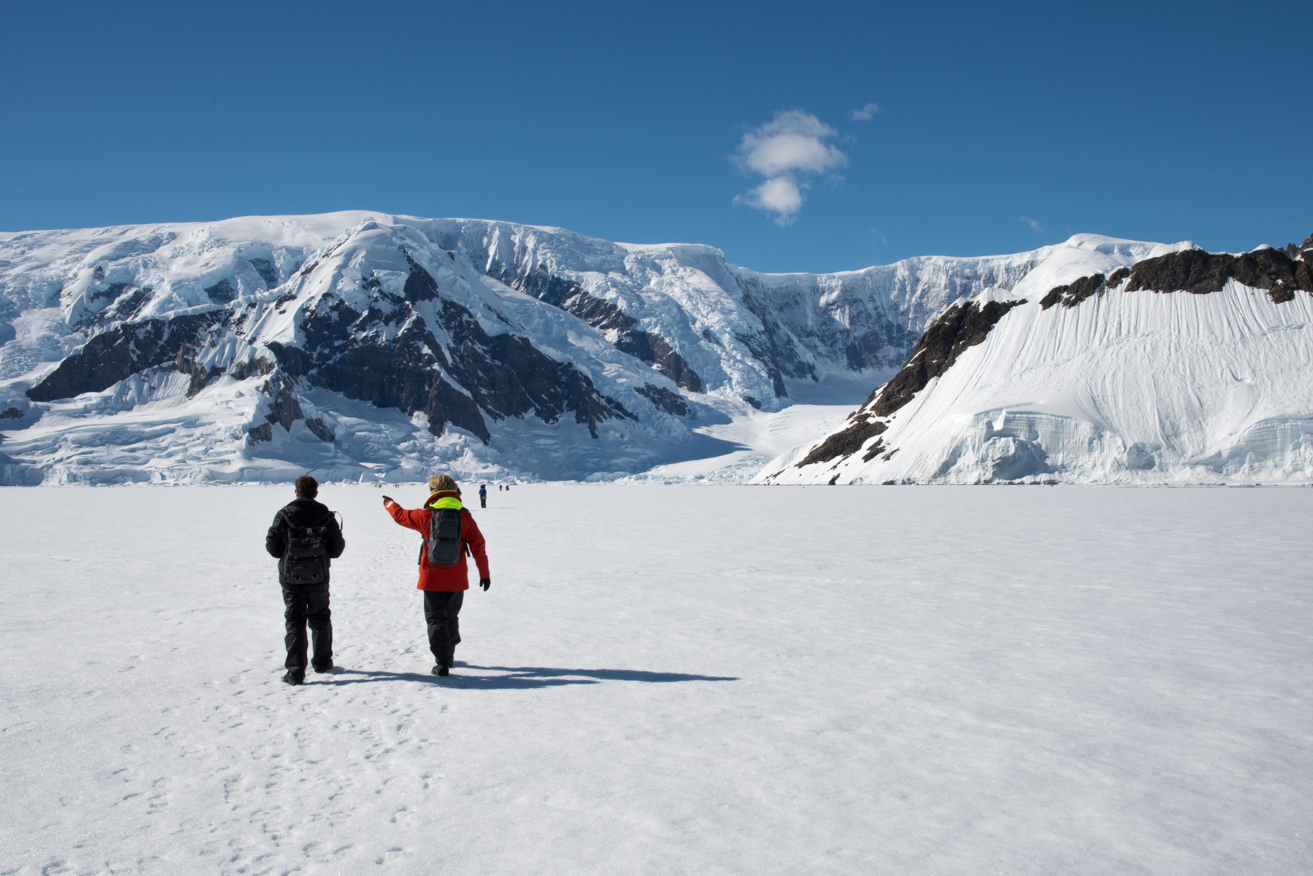 Two guests walking on the fast ice in Antarctica.