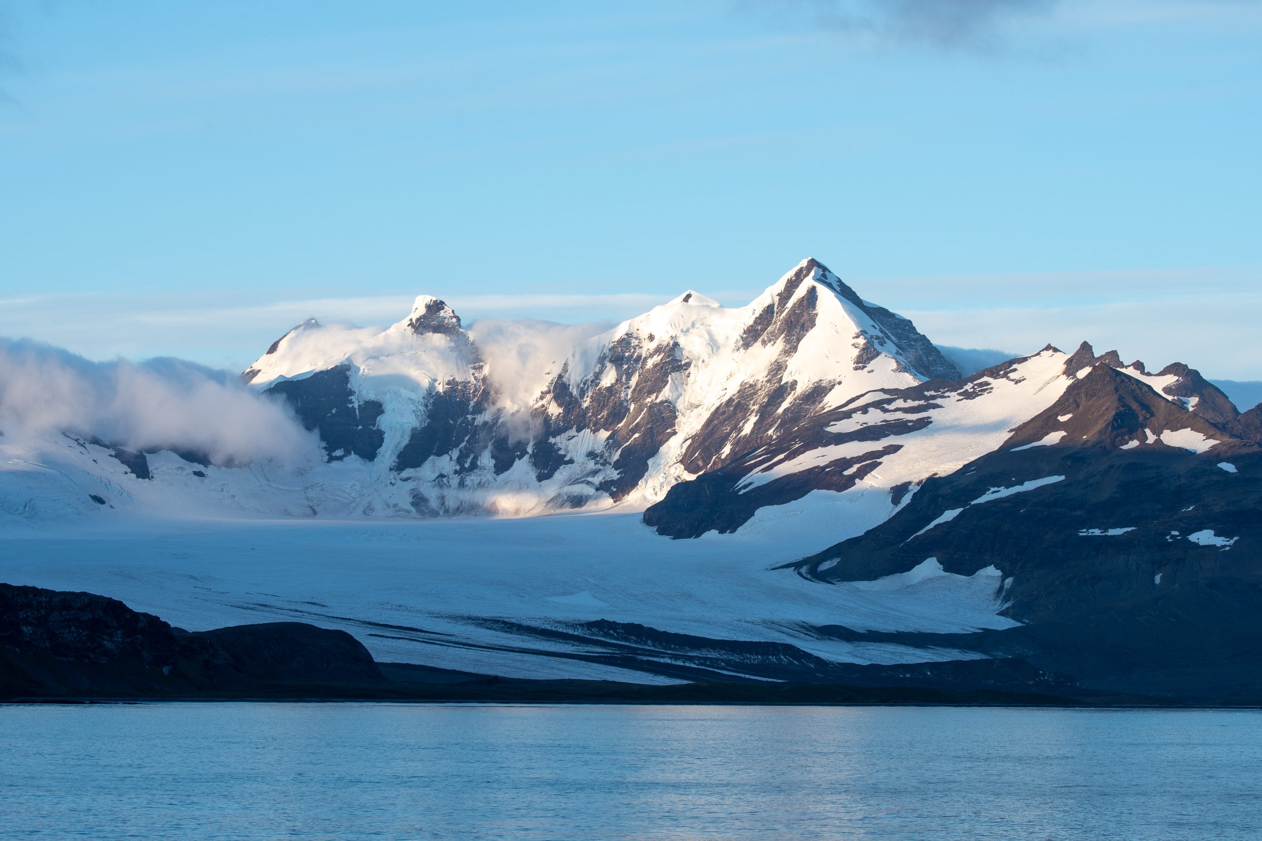 Jagged mountains with flowing glacier in South Georgia.