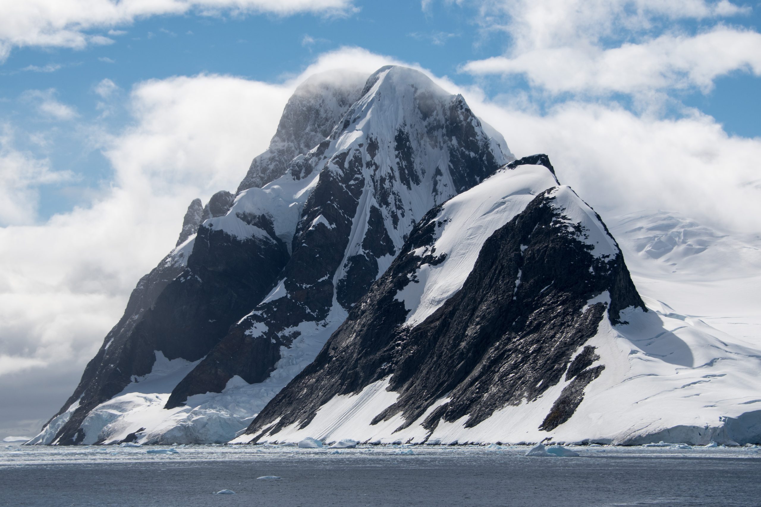 Rugged mountain peak with glacier in Antarctica.