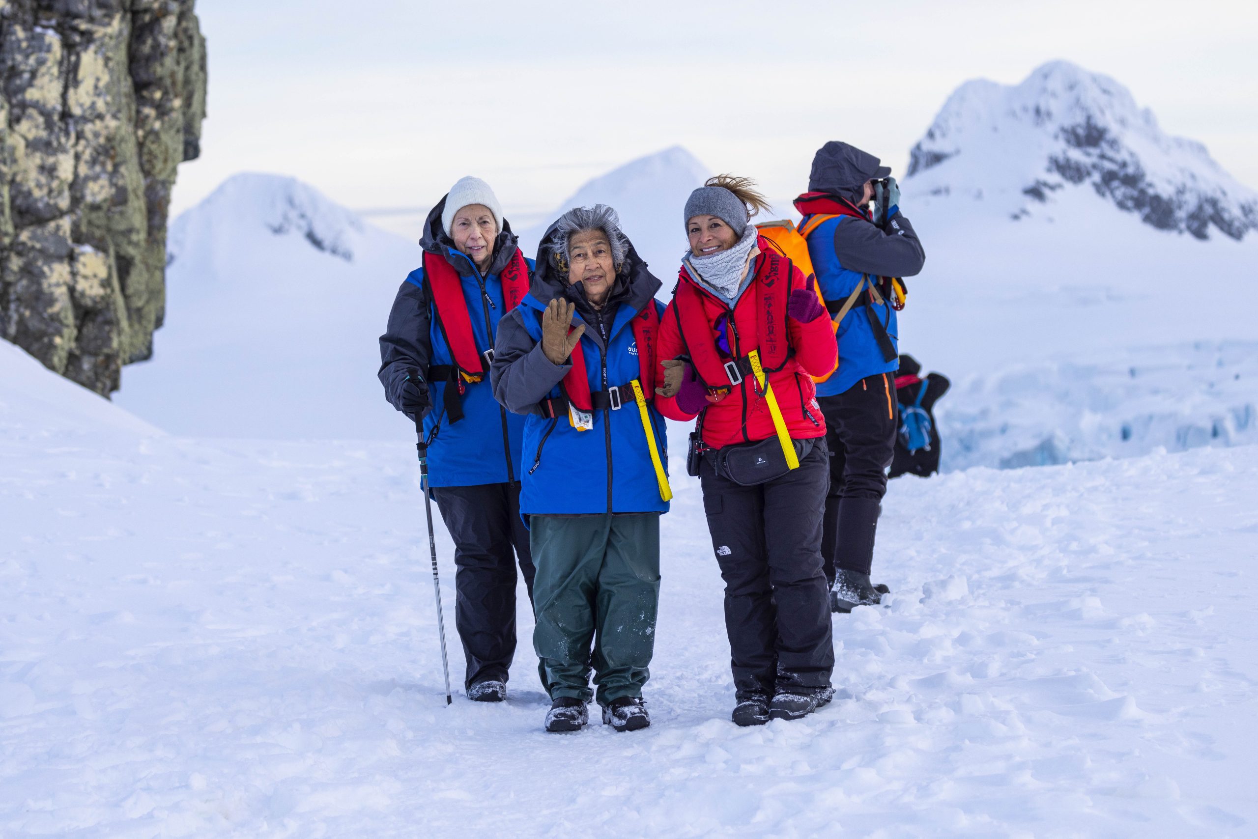 Guests standing in snowy landscape.