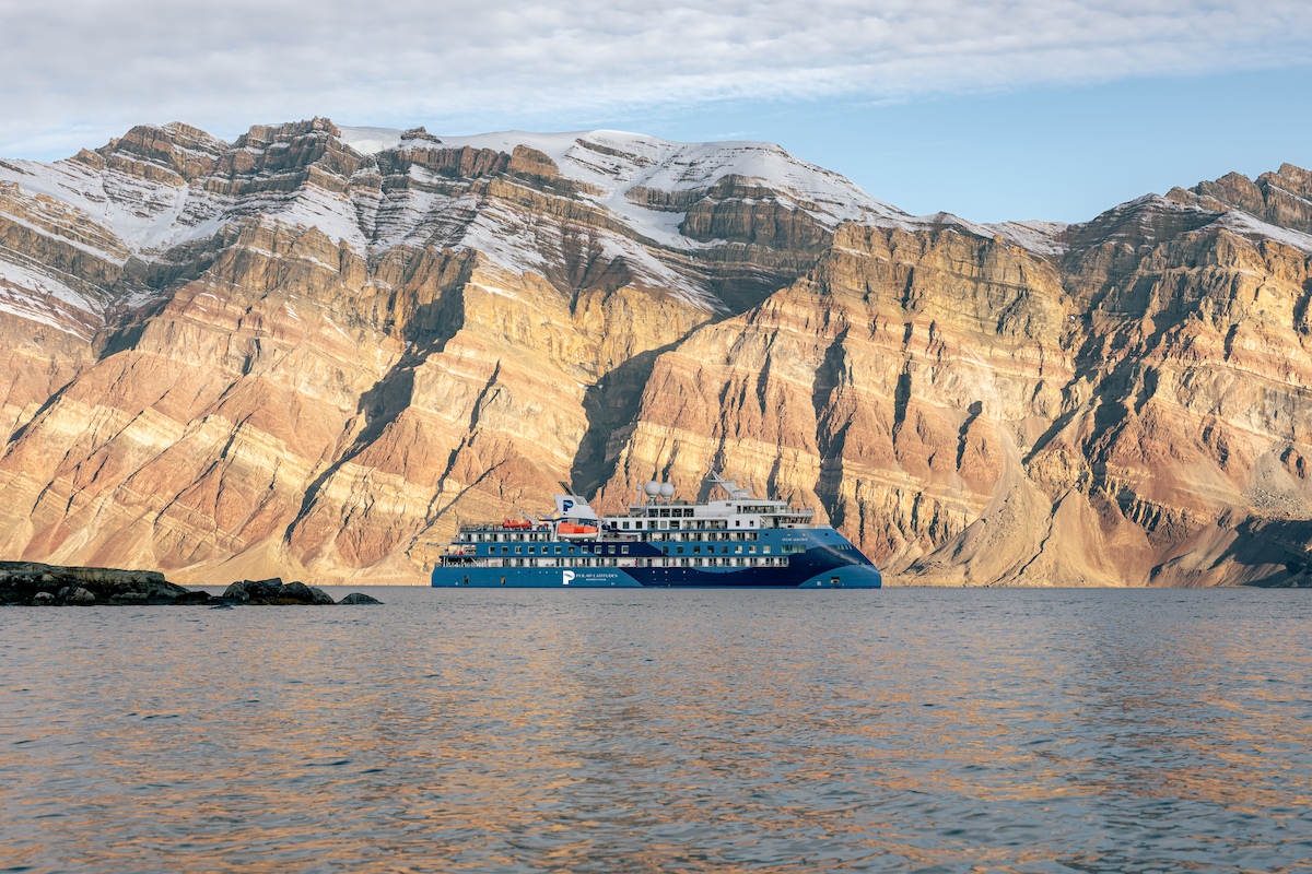 The ship Ocean Albatros in a fjord in East Greenland.